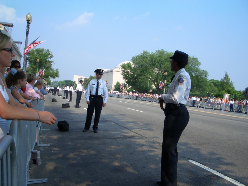 Constitution Avenue, lined by D.C. police ready for the long, hot wait.